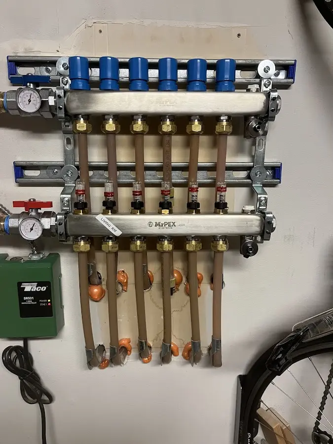 Plumber performing Water Heater Repair at a residential property in Roosevelt